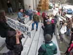 Members of the National Lawyers Guild and the ACLU protest President Donald Trump’s comments on the judiciary and his travel ban.