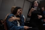 Sun., Oct. 8: A relative of an Israeli missing since a surprise attack by Hamas militants near the Gaza border, is overcome by emotion during a press conference in Ramat Gan, Israel.