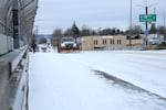 Snow plows go down busy Portland roads after the winter storm.