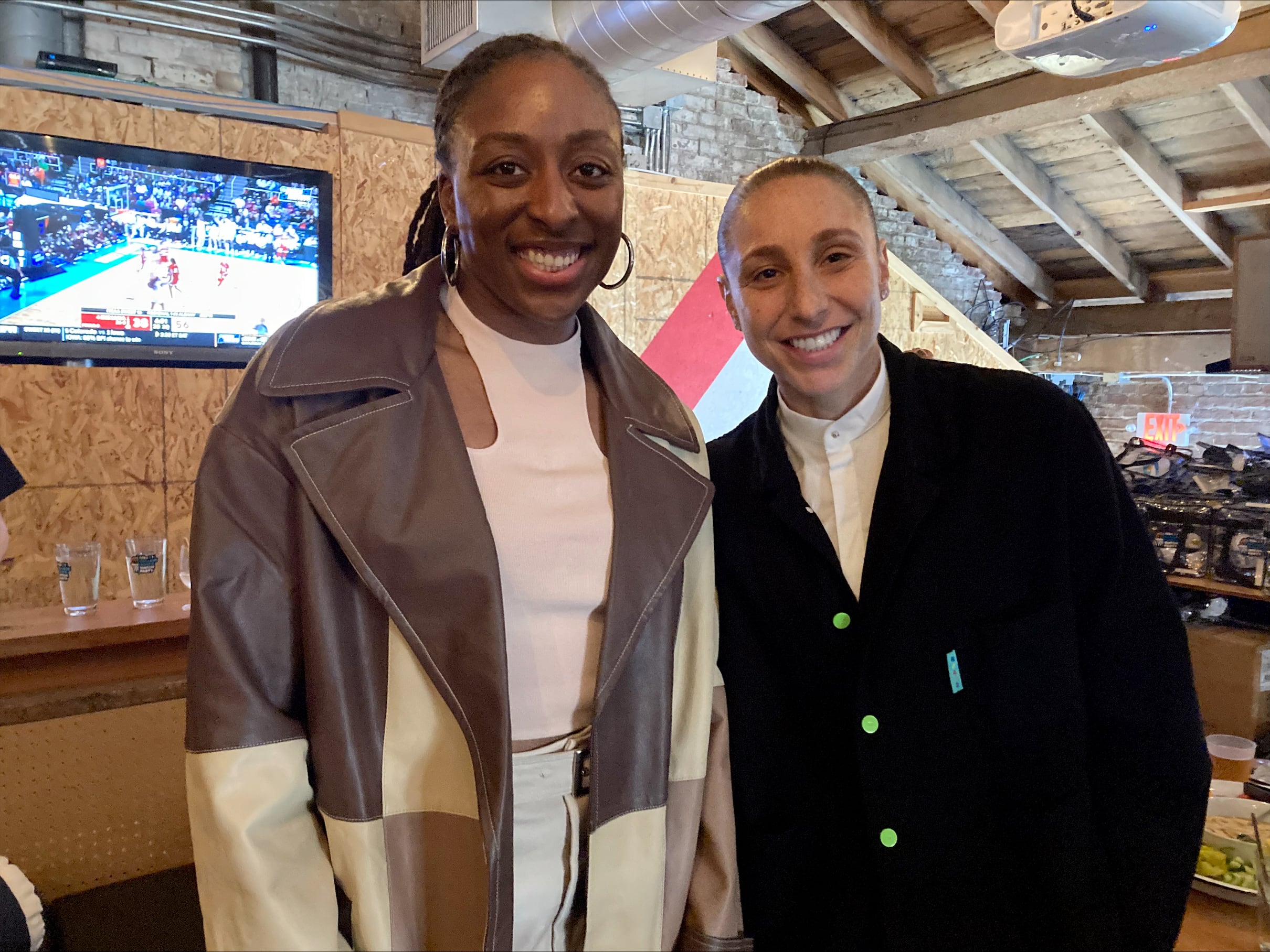 WNBA greats Nneka Ogwumike of the Seattle Storm and Diana Taurasi of the Phoenix Mercury at the Sweet 16 watch party at Spirit of 77 on Mar. 29, 2024, in Portland, Ore. The Sports Bra, media company TOGETHXR and Aflac Insurance sponsored the party.