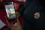 Hanan Khdour, 47, shows the last video taken of her son Mohammad, just minutes before he was killed, in their home in Biddu, the West Bank, on Sept. 19, 2024.