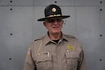 Coos County Sheriff Craig Zanni, center, speaks with Sheriff Department dispatchers on June 6, 2019, in Coquille, Ore.