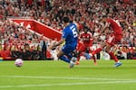Liverpool's Cody Gakpo (right) scores his side's second goal during the English Premier League soccer match between Liverpool and Bournemouth at Anfield stadium in Liverpool, England, on Aug. 15, 2025. Both teams are owned by Americans.
