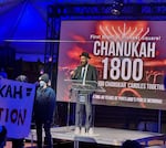 Rabbi Motti Wilhelm of Chabad SW Portland speaks at the Hanukkah menorah lighting at Pioneer Courthouse Square in Portland, Dec. 7, 2023, in this supplied photo.