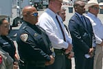 Uvalde School Police Chief Pete Arredondo (second from left) stands during a news conference outside of the Robb Elementary School in Uvalde, Texas, on May 26. He resigned as a member of the Uvalde City Council and remains on administrative leave for his police role.