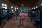 Paris stands in his dormitory at the primary school. At 15, he is starting school for the first time.