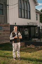 The Rev. Bradley Hyde, a Methodist minister, stands in front of Golden Roast, a coffee shop that moved into a defunct Methodist church in Knoxville, Tenn., that closed because of a dwindling congregation.