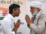 Rishi Sunak meets members of the audience after delivering a speech during a Conservative Friends of India event at the Dhamecha lohana center on Aug. 22, 2022 in Harrow, England.