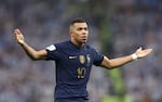 Kylian Mbappe of France celebrates after scoring the team's second goal during the FIFA World Cup Qatar 2022 Final match between Argentina and France at Lusail Stadium on December 18, 2022 in Lusail City, Qatar.