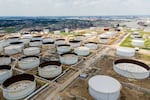 An aerial view of oil storage containers near the Chevron Pasadena Refinery in June 2024 in Pasadena, Texas. The U.S. is the world's largest oil producer. President Trump says he is declaring a national energy emergency as one of his first acts in office.