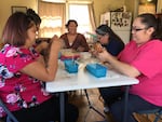 Warm Springs weaver Kelli Palmer teaches a class in the art of corn husk weaving.