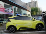 A Seagull electric vehicle from Chinese automaker BYD for test driving is parked outside a showroom in Beijing, Wednesday, April 10, 2024. The tiny, low-priced electric vehicle called the Seagull has American automakers and politicians trembling. The car, launched last year by Chinese automaker BYD, sells for around $12,000 in China. But it drives well and is put together with craftsmanship that rivals U.S.-made electric vehicles that cost three times as much. Tariffs on imported Chinese vehicles probably will keep the Seagull away from America’s shores for now.