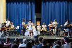 Students and mentors gather onstage to perform for the Pass the Mic showcase in the auditorium of Hosford Middle School in Portland, Ore., Friday, Aug. 2, 2019.