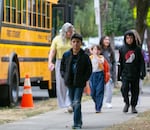 In this Aug. 29, 2023, file photo, students at Sitton Elementary School in Portland walk from the bus to the front entrance of school for their first day of classes. When school resumes this fall, students will face changed schedules aimed, in part, at addressing school bus capacity.