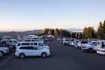 Support vans line up outside the starting line at Timberline Lodge. Each of the more than 1,000 teams gets two support vans.