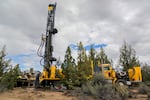 A well drilling rig works to plunge a new domestic well in the high desert east of Bend, Oregon, where state monitoring shows groundwater declines are occurring in step with climate changes and pumping. July 5, 2022.