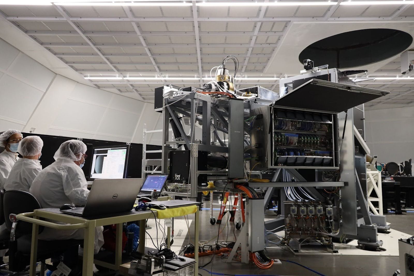NSO and KIS engineers and scientists work on the Visible Tunable Filter (VTF) inside the Coudé Lab at the Inouye Solar Telescope.