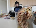 Sibeiho Supper Club co-owner Holly Ong prepares the ingredients for their centerpiece Dungeness Chili Crab dish in downtown Portland, Oregon on April 6, 2022. Sibeiho recently won a Good Food Award for its achar pickle.