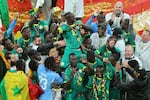 Senegal's Sadio Mane holds the trophy aloft as he celebrates with teammates after winning the Africa Cup of Nations final soccer match between Senegal and Morocco in Rabat, Morocco, Sunday, Jan. 18, 2026.