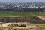 This picture taken from Israel's southern border with the Gaza Strip shows an Israeli army tank moving along the border with the Palestinian territory on March 20.