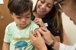 FILE- In this 2017 photo from the CDC, a health care provider placed a bandage on a child, who had just received a flu vaccine. In Oregon, the OHA reported Thursday, May 15, 2025 that nearly one in 10 Oregon kindergartners have a non-medical exemption to some or all of the vaccines that are required to attend school.