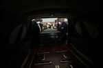 FILE - In this Saturday, April 18, 2020 file photo, mortician Cordarial O. Holloway, foreground left, funeral director Robert L. Albritten, foreground right, and funeral attendants Eddie Keith, background left, and Ronald Costello place a casket into a hearse in Dawson, Ga. This is the deadliest year in U.S. history, with deaths topping 3 million for the first time. It's due mainly to the coronavirus pandemic that has killed nearly 320,000 Americans. (AP Photo/Brynn Anderson)