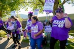 FILE: Kaiser workers dance on the picket line while striking outside Sunnyside Hospital in Clackamas, Oregon, on Thursday, Oct. 5, 2023.  The union was pushing for higher wages, saying low pay was contributing to turnover and short staffing.