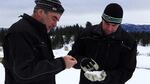 Idaho Power's Derek Blestrud and Brandal Glenn study the type of snow that's falling as a result of cloud seeding.