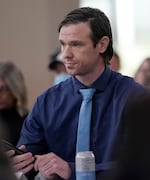 Shawn McMurtrey, a disabled combat veteran who was recently fired from his job in the U.S. Department of Agriculture, speaks to legislators during a town hall in Portland, Ore., March 17, 2025. 