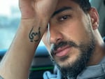 Ibrahim Hassouna, 30, a Gaza social media influencer known as Kazanova, has the phrase "my mom" tattooed on his wrist in Arabic. Most of his family was killed in a Feb. 12 Israeli military operation to rescue hostages.