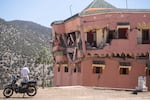 A man stands next to a damaged hotel after the earthquake in Moulay Brahim village, near the epicentre of the earthquake, outside Marrakech, Morocco.