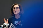 Oregon Gov. Kate Brown issues a shut down of restaurants at a press conference in Portland, Oregon, on March 16, 2020.