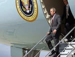 President Bush walks off the steps of Air Force One at Offutt Air Force Base near Omaha, Neb. after two planes crashed into the World Trade Center on Sept. 11, 2001.