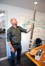 Jason Pulley displays how sand and gravel filtration works at the Salem Public Works’ water filtration facility in Stayton, Ore., July 31, 2025. 