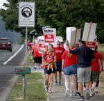 Members and supporters of the Camas Education Association demonstrate outside of Camas High School on Aug. 28, 2023. The strike appears to be the school district's first ever, according to union and district officials.