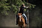 Beesh Lotspeich shoots arrows from the back of a cantering horse during an official competition of the World Federation of Equestrian Archery held at the Flying Duchess Ranch in Arlington, Washington.