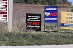 Signs urged local voters to vote "no" and defund the Patmos Library in Jamestown Township, Mich., after some residents objected to books they thought were inappropriate for young readers. The "no" votes prevailed, and the library says without the tax dollars, it may have to close.