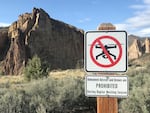 In this file photo, a sign conveys how drones are prohibited from flying at Smith Rock State Park in Terrebonne during raptor nesting season from January until August. Senate Bill 812 would let city and county governments in Oregon ban the takeoff and landing of any unmanned aircraft in parks.