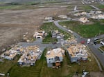 Damaged houses are seen after a tornado passed through the area near Omaha, Neb., on Friday, April 26, 2024.