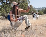 ONDA volunteer Ellysa Lindenmaier removing fence on Steens Mountain in Oregon in 2017.