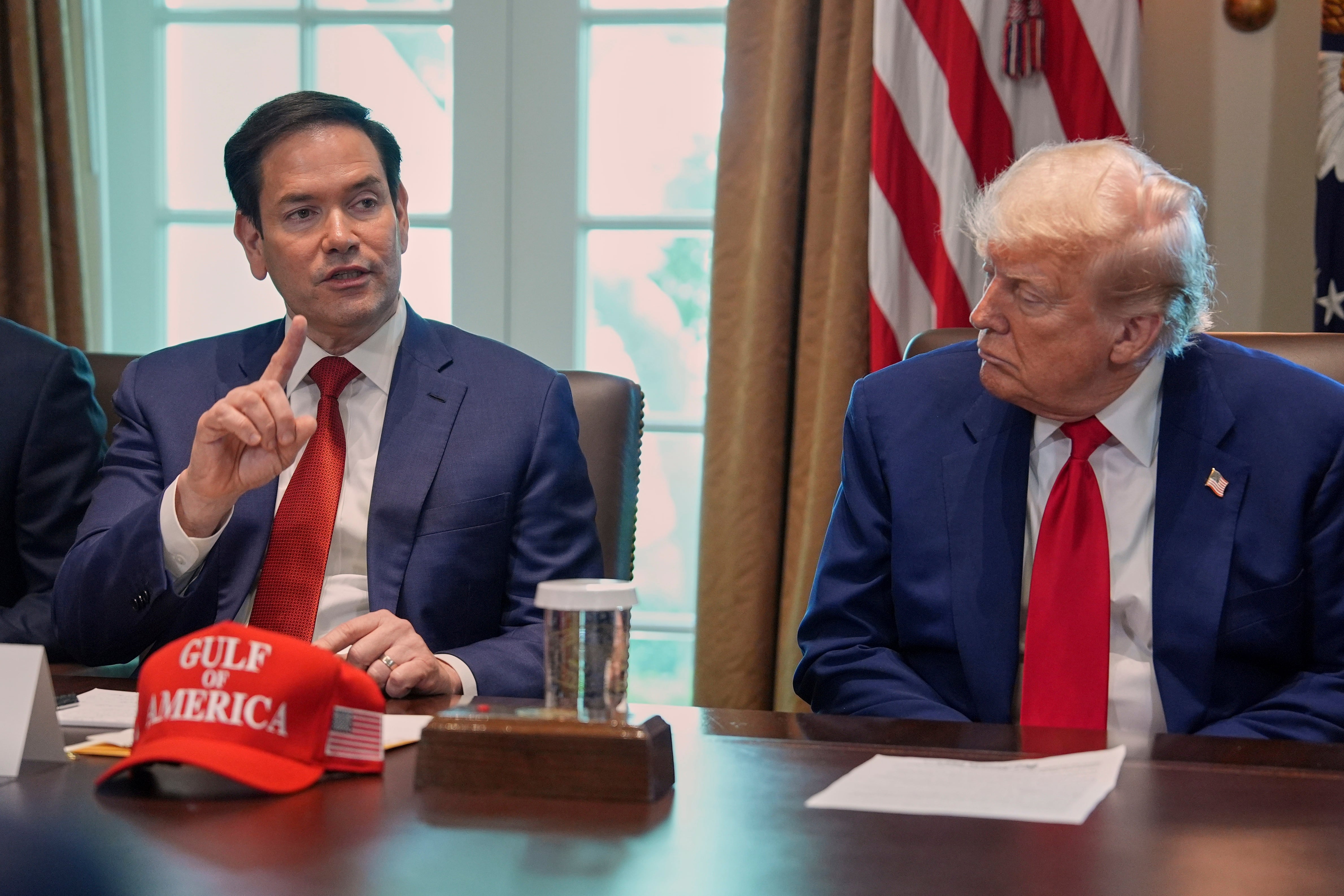Secretary of State Marco Rubio speaks during a cabinet meeting at the White House, Wednesday, April 30, in Washington, as President Donald Trump look on.