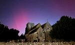 Northern lights on display in the skies over Great Chart Church, Ashford, Kent, England, on Oct. 10.