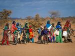 People arrive at a displacement camp amid a drought on the outskirts of Dollow, Somalia.