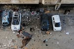 Palestinians survey the damage to an apartment building after an Israeli military strike killed several people in Gaza City Saturday, Jan. 31, 2026.