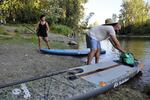 Ilena Allen-Deo and Deion Deo paddleboard along the Columbia Slough on July 18, 2023. “This has definitely improved within my lifetime for sure. Born in 1996, and I remember it was pretty bad in middle school, high school.”