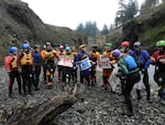 Paddlers with American RIvers, Friends of the White Salmon, Columbia Riverkeeper, and several other conservation groups celebrate at the restored dam site. 