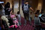 Families chat in the hallway at the maternity care unit in the Roosevelt Hotel.