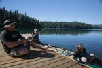Portland father fishing for Kokanee with his sons at Suttle Lake in Sisters, Oregon.