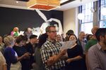 A crowd fills Revolution Hall's Show Bar for a Low Bar Chorale singalong.