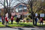 Bend Bulletin guild members and supporters participate in a noon picket in Bend, Ore., on Oct. 28, 2025.